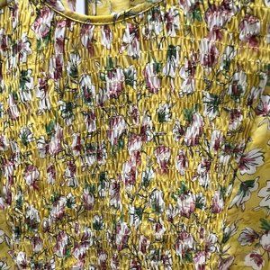 Very bright and lovely top with gathered front .